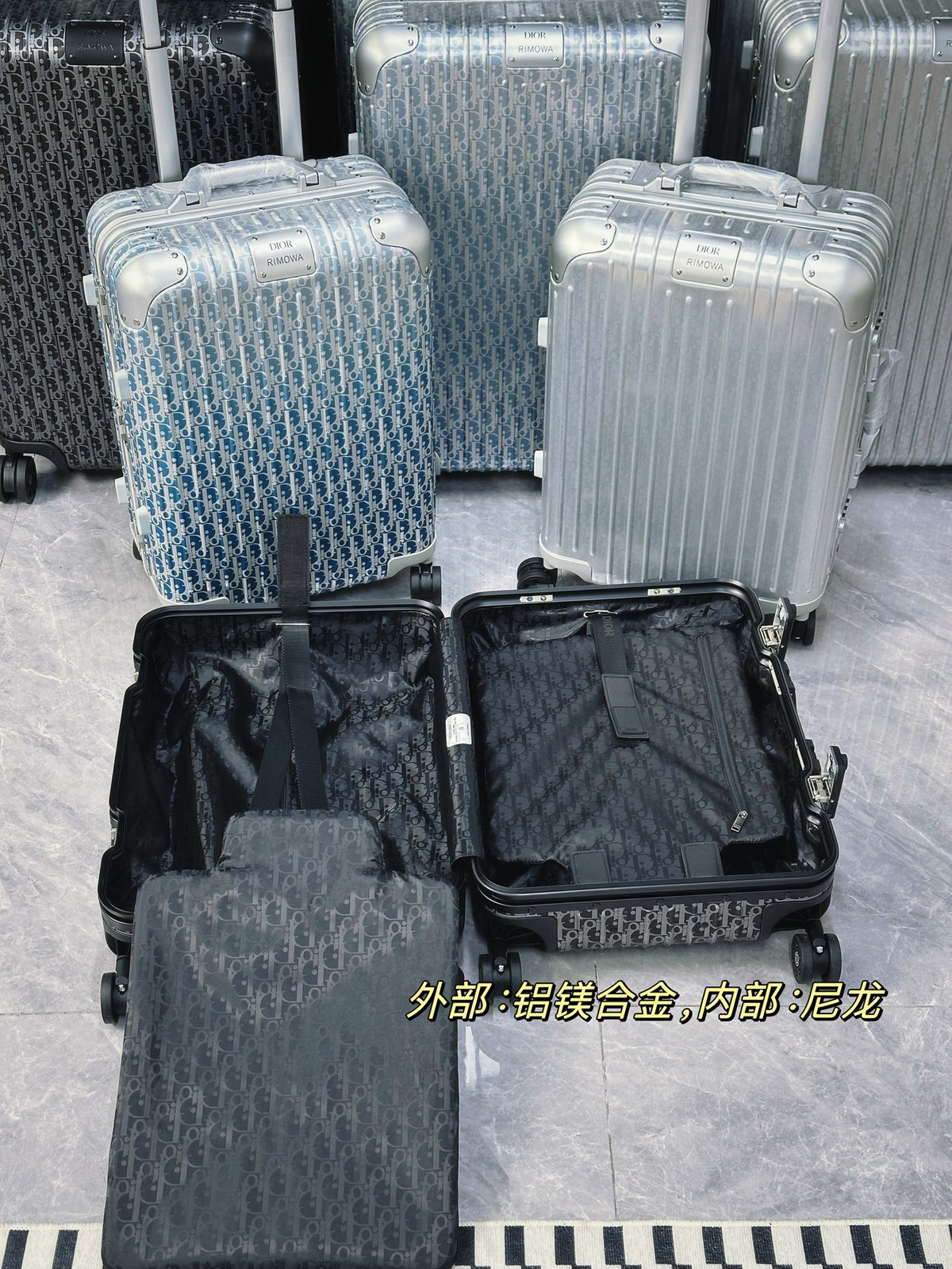 Silver Aluminum Hardside Spinner Suitcase with Monogram Pattern