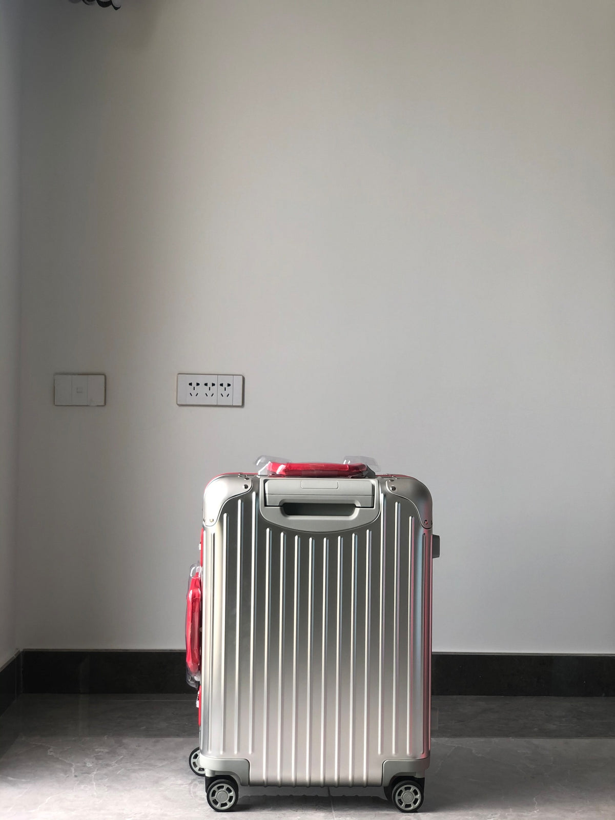 Silver Metallic Hardside Spinner Suitcase with Pink Accent