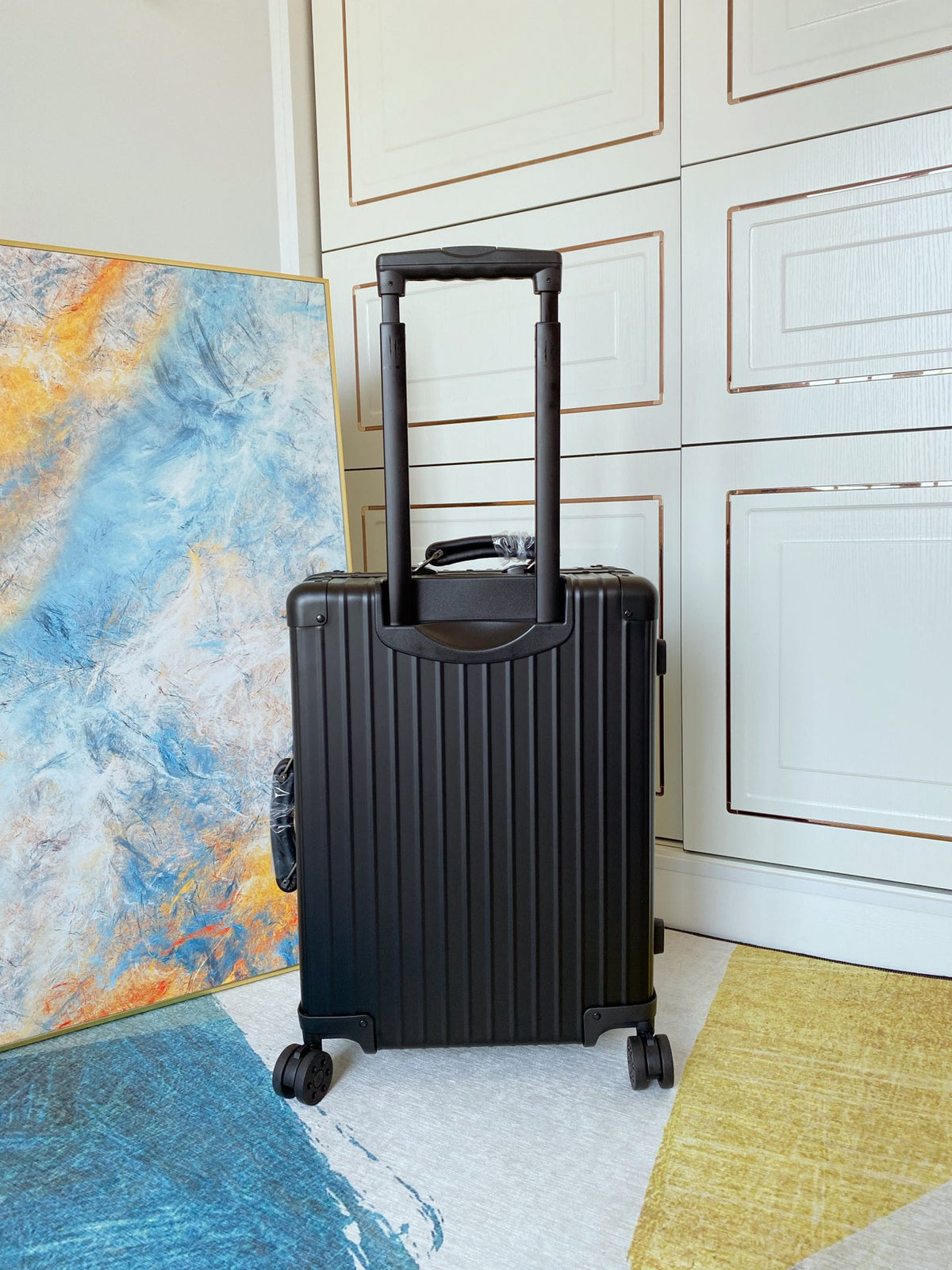 Sleek Matte Black Ribbed Carry-On Hardshell Spinner Suitcase