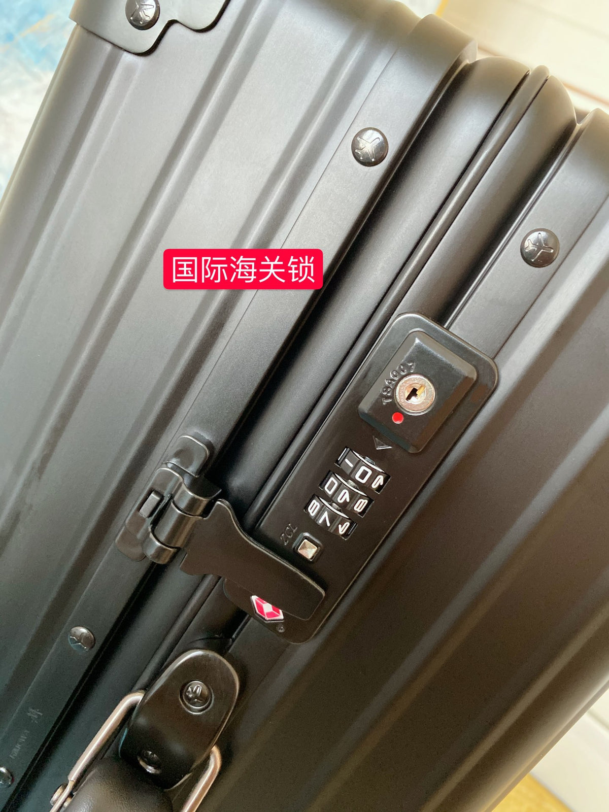 Sleek Matte Black Ribbed Carry-On Hardshell Spinner Suitcase